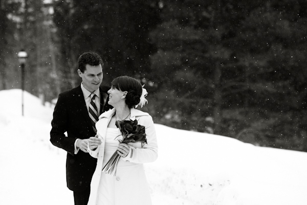 bride and groom in the snow- photo by Denver based wedding photographers Adam and Imthiaz